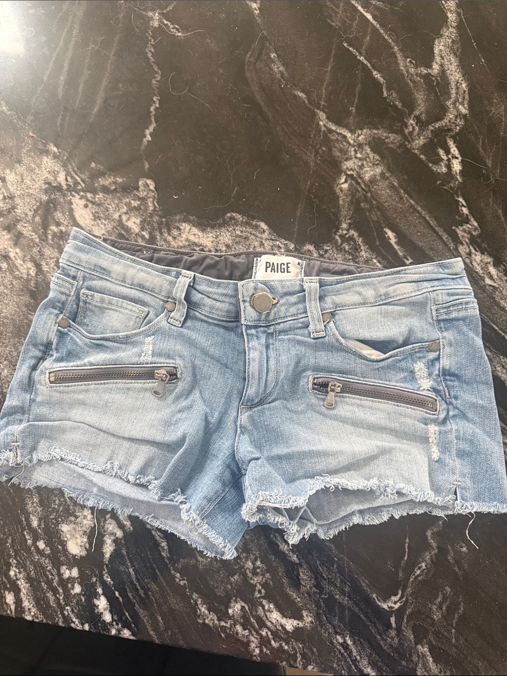 PAIGE Light Blue Frayed Denim Cutoff Shorts with Zip Pockets